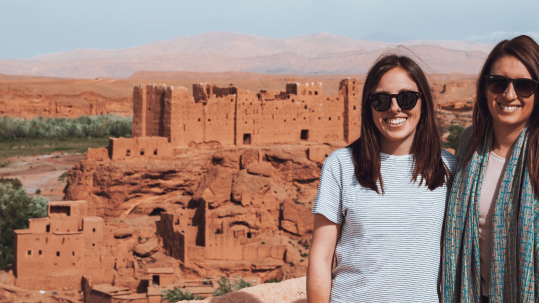Female traveler enjoying a safe and scenic journey through the vibrant streets of Marrakech, Morocco, showcasing the country's rich culture and welcoming atmosphere for solo women travelers.